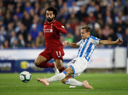 Soccer Football - Premier League - Huddersfield Town v Liverpool - John Smith's Stadium, Huddersfield, Britain - October 20, 2018 Liverpool's Mohamed Salah in action with Huddersfield Town's Chris Lowe Action Images via Reuters/Carl Recine