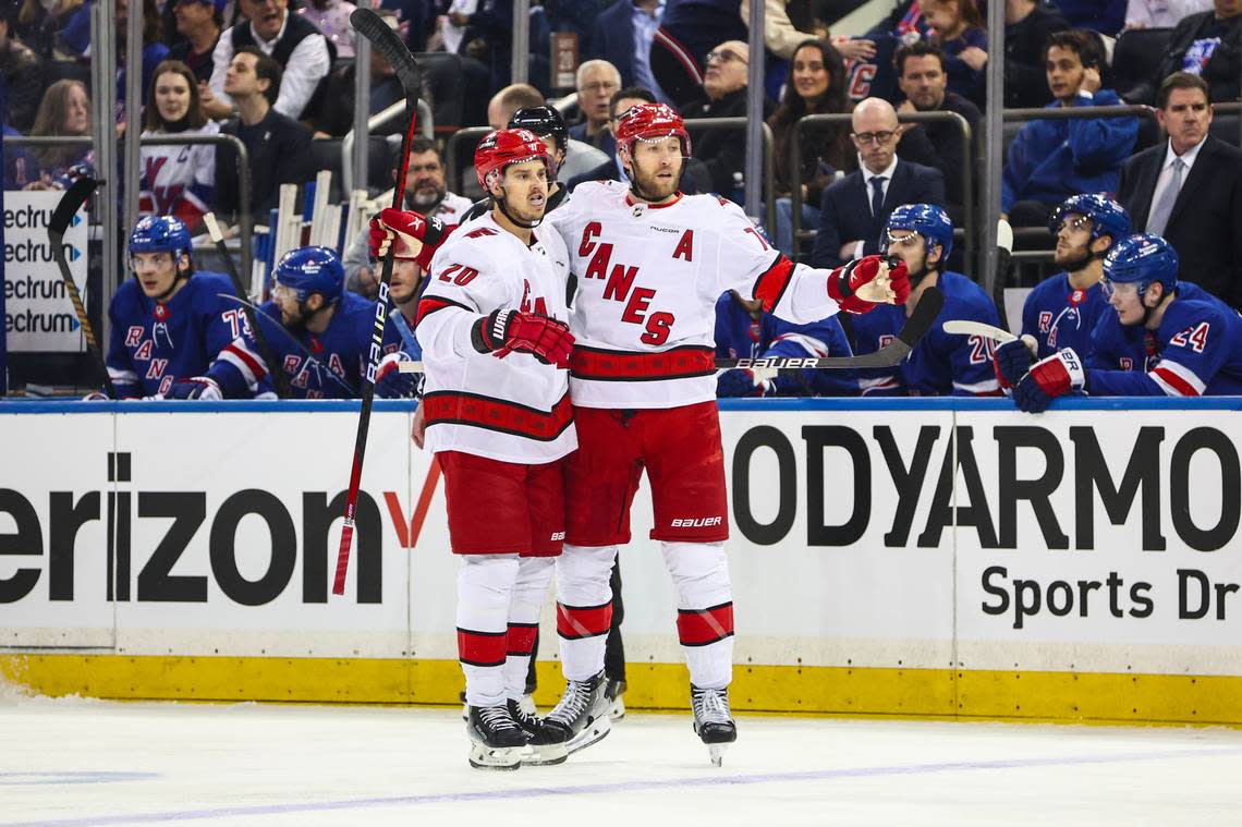 Carolina Hurricanes defenseman Jaccob Slavin (74) celebrates with center Sebastian Aho (20) after scoring a goal in the first period against the New York Rangers in game one of the second round of the 2024 Stanley Cup Playoffs at Madison Square Garden. Wendell Cruz/Wendell Cruz-USA TODAY Sports