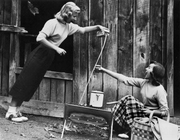 Two women experience the Wonder Spot in Wisconsin Dells in 1957.