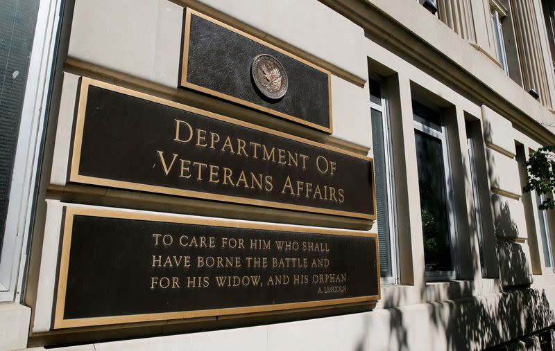 FILE PHOTO: FILE PHOTO: The sign of the Department of Veteran Affairs is seen in front of the headquarters building in Washington