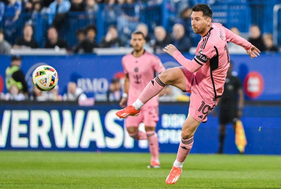 Inter Miami's Lionel Messi plays a pass during the first half of MLS soccer action against CF Montreal in Montreal, Saturday, May 11, 2024.