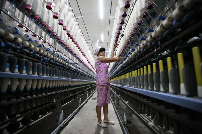 A labourer is seen working in a textile factory in Huaibei, on July 24, 2013. New figures suggest the manufacturing sector has started to stabilise