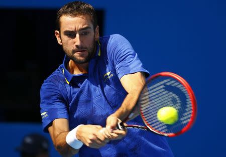 Marin Cilic of Croatia returns the ball during his men's singles match against Yan Bai of China at the China Open tennis tournament in Beijing September 29, 2014. REUTERS/Petar Kujundzic