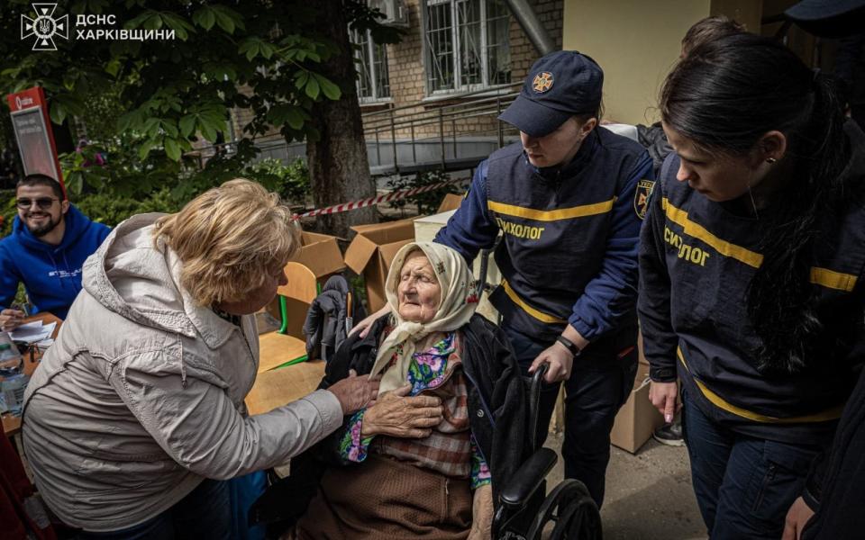 This handout photograph taken and released by Ukrainian Emergency Service on May 17, 2024, shows rescuers evacuating civilian people from Russian shelling in Kharkiv region.