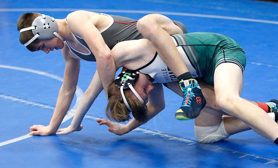 Loudonville's Drew Spreng wrestles Smithville's Caden Shaffer during their match at the OHSAA Division III sectional wrestling tournament Saturday, Feb. 26, 2022 at Northwestern High School. TOM E. PUSKAR/TIMES-GAZETTE.COM