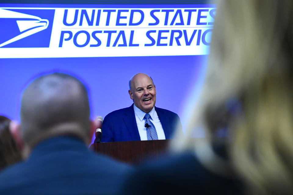 DENVER, CO - MARCH 16: United States Postmaster General Louis DeJoy addresses soon to be Postmasters before they take oath of office during a pledge ceremony at the General Mail Facility on March 16, 2022 in Denver, Colorado.  Thirty Postmasters from around Colorado took the oath of office in a special ceremony to become postmasters for post offices all over Colorado. United States Postmaster General Louis DeJoy made a surprise visit to the facility and led them in the traditional Oath of Office to swear them into their new positions. 