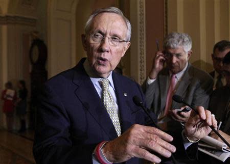 U.S. Senate Majority Leader Harry Reid (D-NV) (L) speaks to the media on Capitol Hill in Washington October 29, 2013. REUTERS/Yuri Gripas