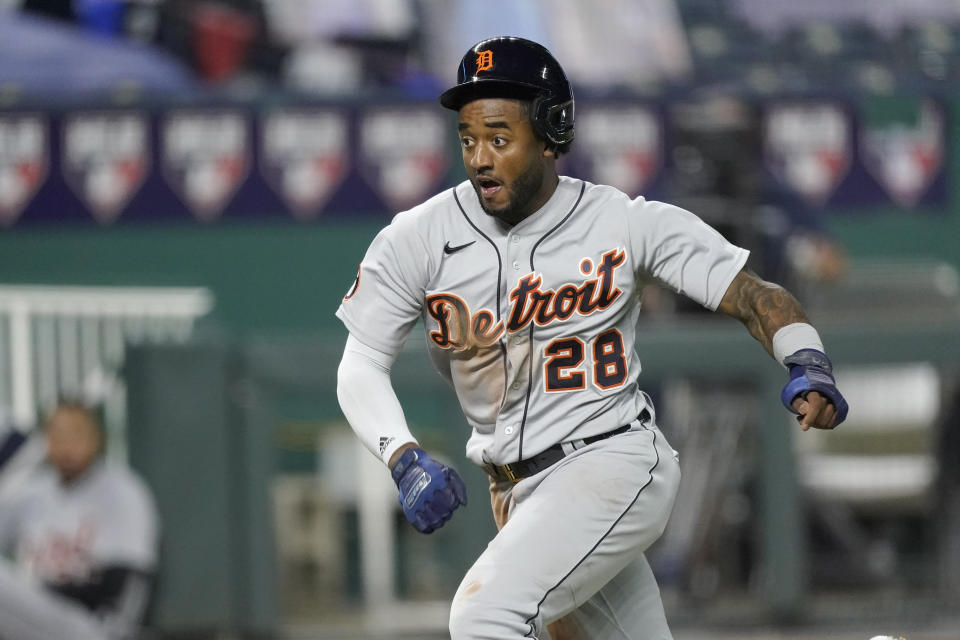 Detroit Tigers' Niko Goodrum runs home to score on a sacrifice fly by Eric Haase during the seventh inning of the team's baseball game against the Kansas City Royals on Friday, Sept. 25, 2020, in Kansas City, Mo. (AP Photo/Charlie Riedel)
