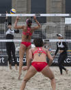 China's Xi Zhang (2nd R) and her teammate Chen Xue (2nd L) vie for the ball with Brooke Hanson (L) and Lauren Fendrick (R) of the US during their FIVB Beach-Volleyball Grand Slam 2012 match in Berlin on July 12, 2012. The team of China won the match 21-14, 21-19. The Grand slam takes place from July 10 to 15, 2012. AFP PHOTO / DAVID GANNONDAVID GANNON/AFP/GettyImages