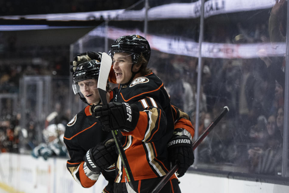 Anaheim Ducks center Trevor Zegras (11) celebrates after his goal with defenseman John Klingberg (3) during the first period of an NHL hockey game against the San Jose Sharks, in Anaheim, Calif., Friday, Jan. 6, 2023. (AP Photo/Kyusung Gong)