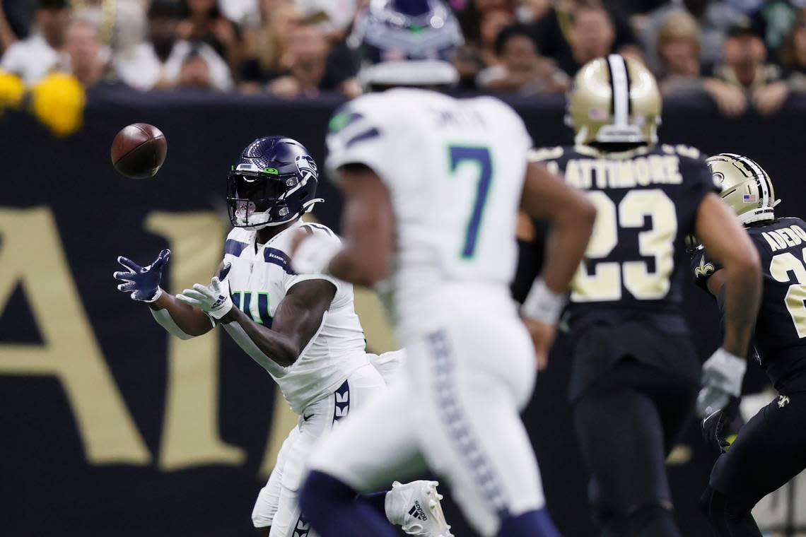 Seattle Seahawks wide receiver DK Metcalf catches a touchdown pass from quarterback Geno Smith during an NFL football game against the New Orleans Saints in New Orleans, Saturday, Oct. 8, 2022. (AP Photo/Derick Hingle)