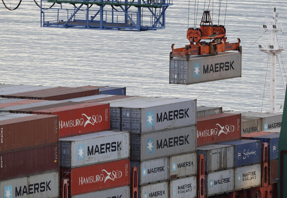 Containers are loaded onto a ship for export at Lyttelton Port near Christchurch, New Zealand, Wednesday, June 3, 2020. New Zealand is hosting this year's Asia-Pacific Economic Cooperation (APEC) forum, which culminates in a leader's meeting on Saturday, Nov. 13, 2021. Continued outbreaks of the coronavirus and related travel restrictions have confined the meeting to the virtual realm for a second straight year. (AP Photo/Mark Baker)