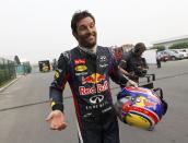 Red Bull Formula One driver Mark Webber of Australia reacts as he returns to the garage area after he retired from the race during the Indian F1 Grand Prix at the Buddh International Circuit in Greater Noida, on the outskirts of New Delhi, October 27, 2013. REUTERS/Adnan Abidi (INDIA - Tags: SPORT MOTORSPORT F1 TPX IMAGES OF THE DAY)