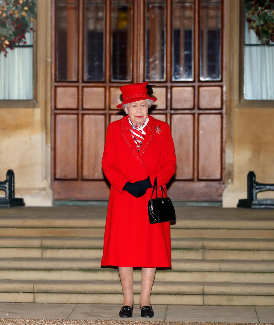 The Queen wore red to thank volunteers and key workers from Windsor Castle during the COVID-19 pandemic in 2020. (Getty Images)