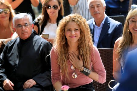 FILE PHOTO: Colombian singer Shakira reacts during her visit to Tannourine Cedars Reserve, in Tannourine, Lebanon July 13, 2018. REUTERS/Jamal Saidi