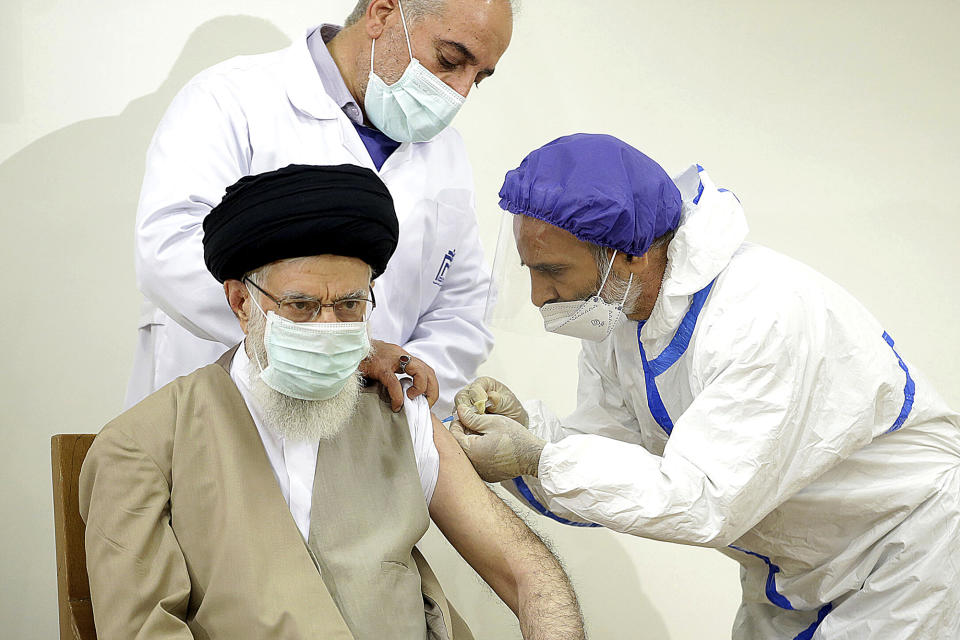 In this photo released by the official website of the Office of the Iranian Supreme Leader, Supreme Leader Ayatollah Ali Khamenei receives a shot of the Coviran Barekat COVID-19 vaccine in Tehran, Iran, Friday, June 25, 2021. (Office of the Iranian Supreme Leader via AP)