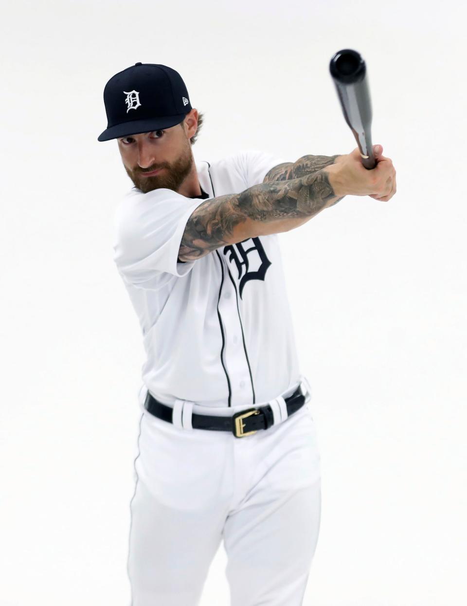Detroit Tigers catcher Eric Haase poses during picture day at spring training in Lakeland, Florida on Sunday, Feb. 19, 2023. Haase loves the outdoors and bears one of the tattoos on his arm represent a momma and father bear with the cubs walking behind them. "That's my wife and kids you don't mess with mom and cubs."
