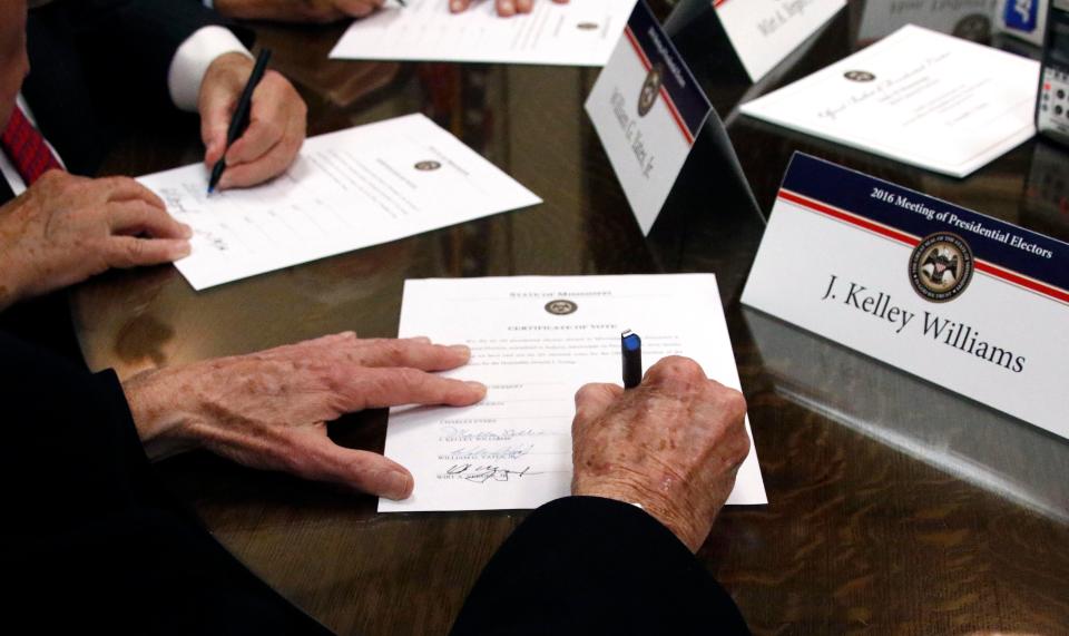 Members of the Mississippi Electoral College formally cast their votes in the 2016 election for president and vice president at the Capitol in Jackson, Miss., on Dec. 19, 2016.