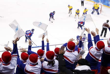 Ice Hockey – Pyeongchang 2018 Winter Olympics – Women Preliminary Round Match - Sweden v Korea - Kwandong Hockey Centre, Gangneung, South Korea – February 12, 2018 - Fans cheer on. REUTERS/Grigory Dukor