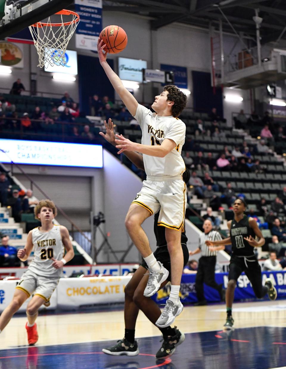 Victor's Garrett Clar drives for a layup during a NYSPHSAA Class AA Boys Basketball Championship semifinal in Glens Falls, N.Y., Friday, March 17, 2023. Victor advanced to the Class AA title game with a 56-41 win over Brentwood-XI.