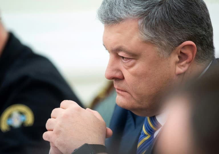 Ukrainian President Petro Poroshenko has asked parliament to vote Monday on whether to impose martial law for 60 days