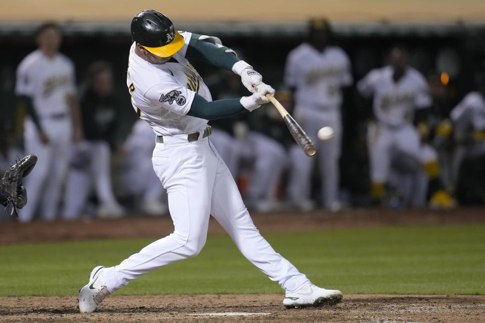 Oakland Athletics' Brent Rooker hits a two-run home run during the ninth inning of a baseball game against the Kansas City Royals in Oakland, Calif., Monday, Aug. 21, 2023. (AP Photo/Jeff Chiu)