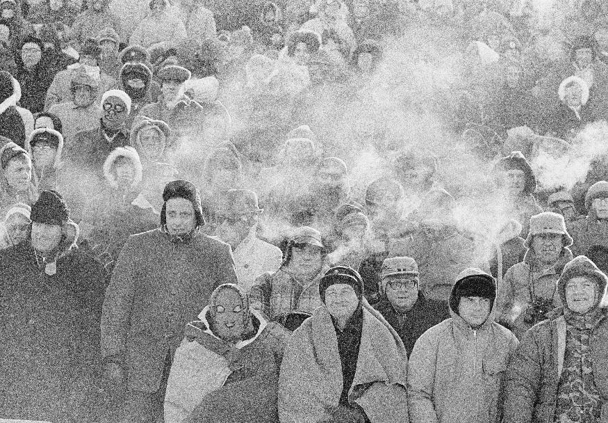 FILE - In this Dec. 31, 1967 file photo, fans watch the Green Bay Packers play the Dallas Cowboys in the NFL Championship game in Green Bay, Wisc. Comparisons to the legendary 1967 Ice Bowl are inevitable when the mercury dips below zero at Lambeau Field. But even if temperatures sink to minus 13 Sunday, Jan. 5, 2014, at the 49ers-Packers playoff game, modern technology will ensure fans are warmer than their predecessors. (AP Photo/File)