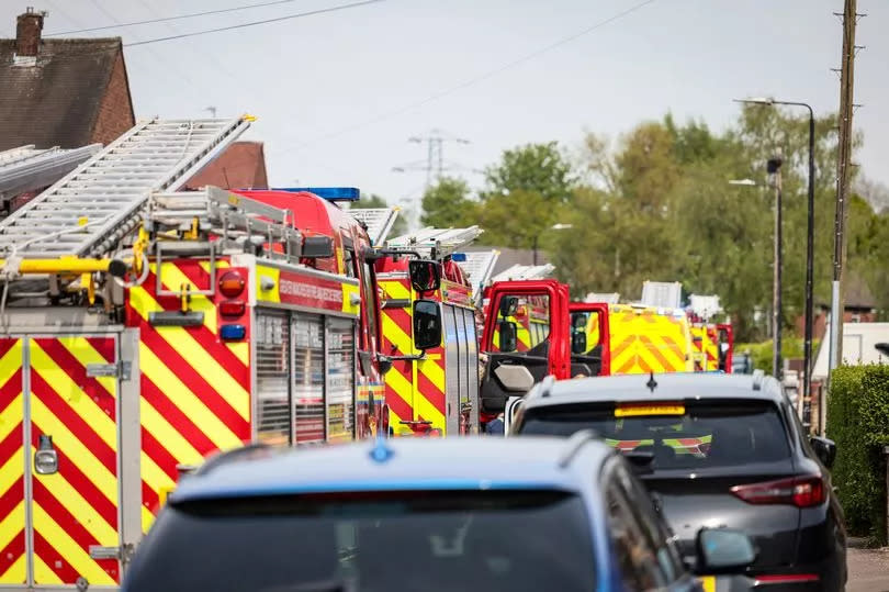 Emergency services at the scene of a house fire in Partington