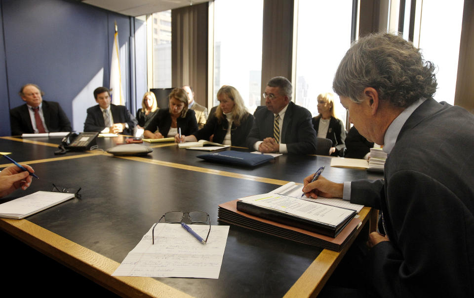 David Meier, right, special consul to the Governor appointed to lead the review of drug convictions which might have been compromised by a State Police drug testing lab, leads a meeting at the Department of Public Safety in Boston, Monday, Sept. 24, 2012. Prosecutors, defense attorney's along with representatives from the District Attorney's office, the U.S. Attorney's office, the State Police and the Department of Public Safety were in attendance. (AP Photo/Stephan Savoia)
