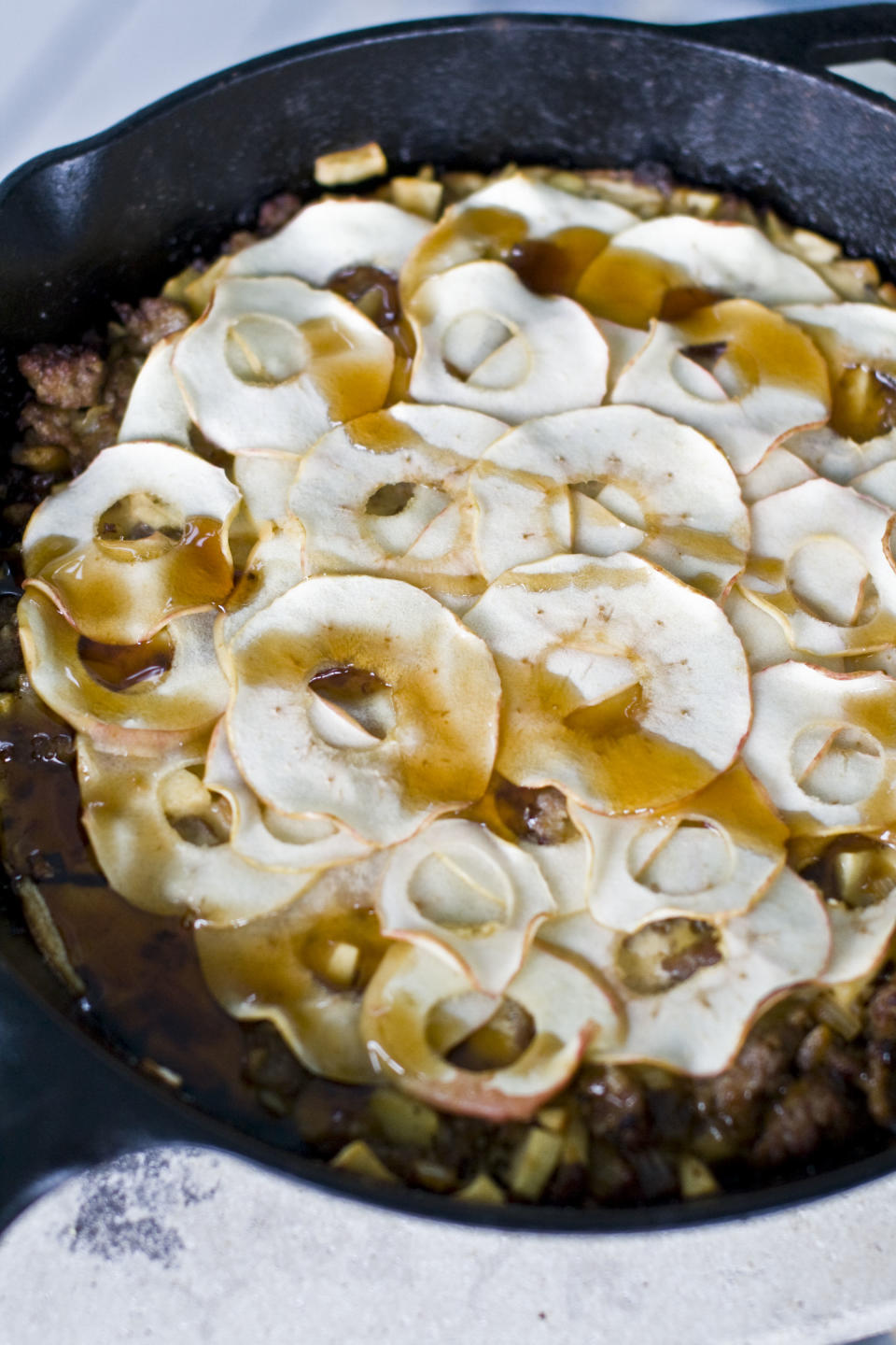 This Aug. 26, 2013 photo shows a sausage and apple Dutch baby in Concord, N.H. (AP Photo/Matthew Mead)