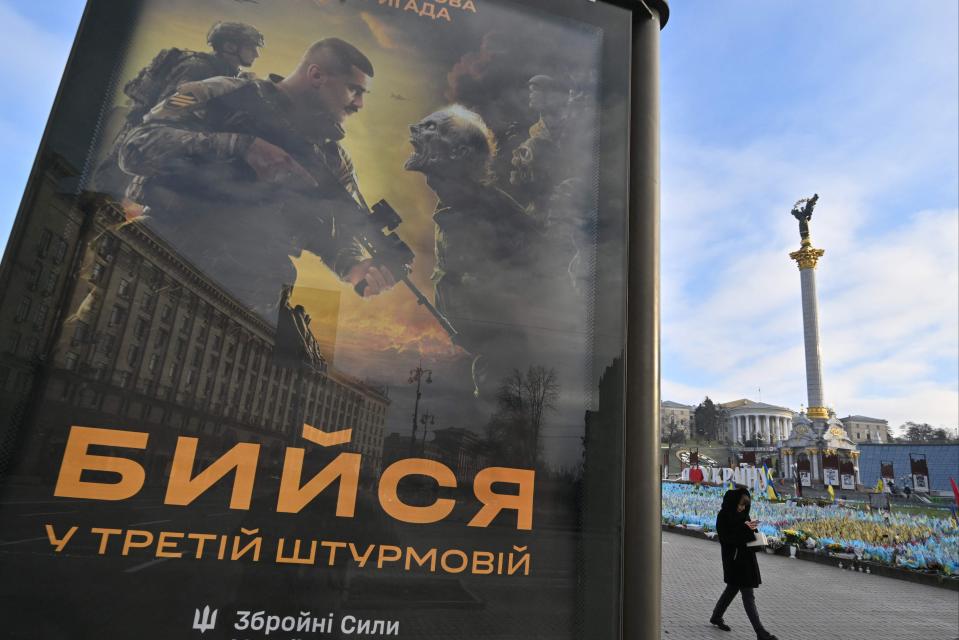 A poster depicting Ukrainian servicemen fighting with Russian ‘orcs’ with a sign reading ‘Fight together in 3rd assault brigade (a brigade of the Ukrainian Ground Forces)’ in Kyiv (AFP via Getty Images)