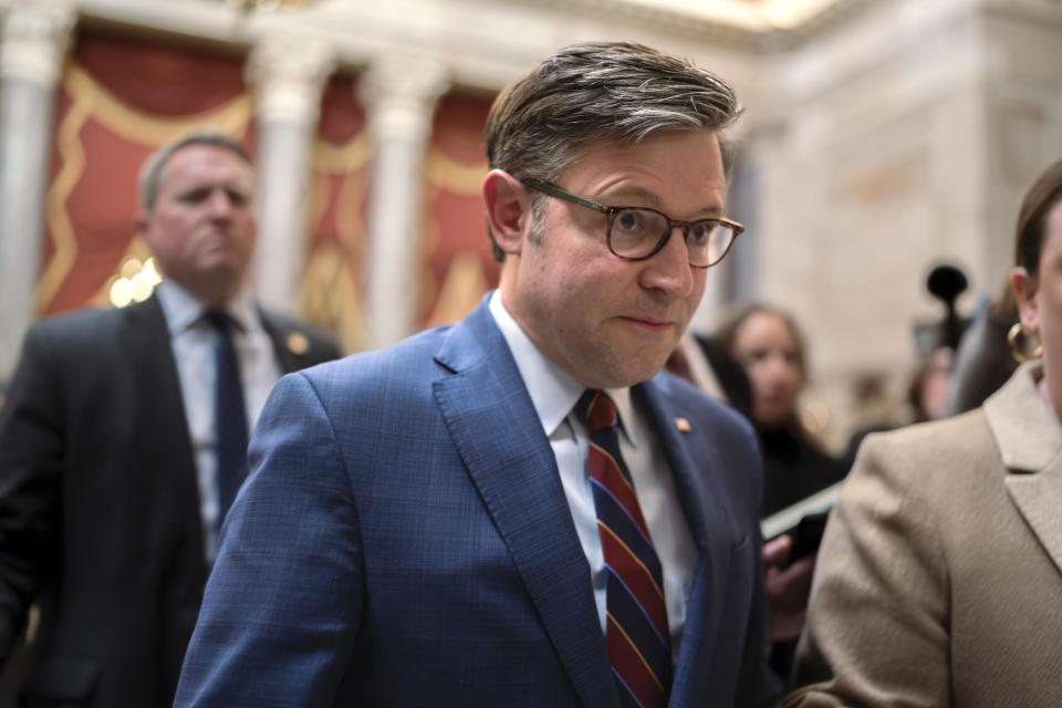 Speaker of the House Mike Johnson, R-La., maneuvers past reporters asking about the Senate border security bill as he arrives at his office in the Capitol, in Washington, Monday, Feb. 5, 2024. Johnson has declared the bipartisan bill "dead on arrival" in the House. (AP Photo/J. Scott Applewhite)