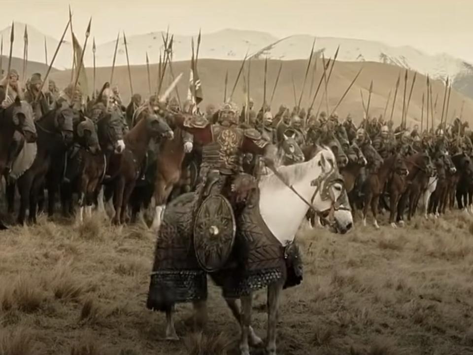 King Theoden on his horse snowmane in front of an army