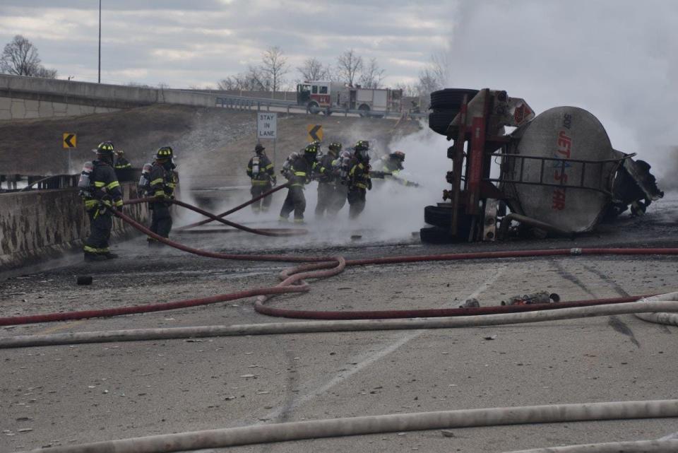 Indianapolis firefighters fought intense flames after a tanker truck carrying about 4,000 gallons of jet fuel overturned Feb. 20, 2020, and ignited in the intersection of Interstates 465 and 70. The truck driver died from injuries.