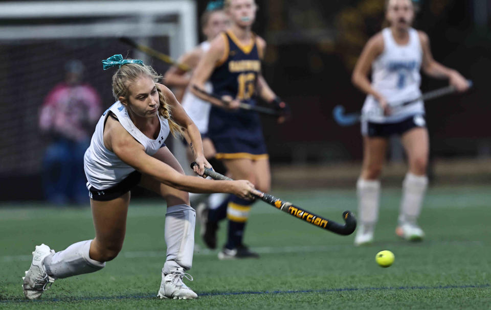 Mount Notre Dame's Lucy Sander (7) passes the ball during a field hockey regional semifinal game against Oakwood Tuesday, Oct. 25.