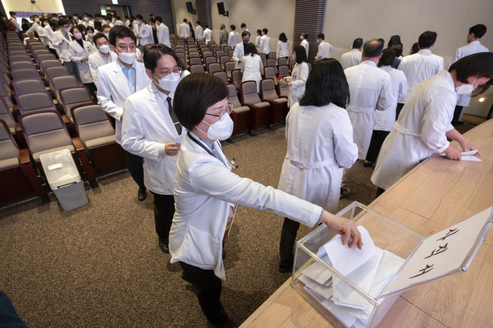 FILE - Medical professors queue to submit their resignations during a meeting at Korea University in Seoul, South Korea, Monday, March 25, 2024. As South Koreans prepare to vote for a new 300-member parliament next week, many are choosing their livelihoods and other domestic topics as their most important election issues. This represents a stark contrast from past elections, which were overshadowed by security and foreign policy issues like North Korean nuclear threats and the U.S. security commitment. (Yoon Dong-jin/Yonhap via AP, File)