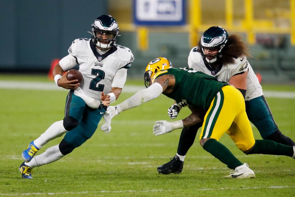 Philadelphia Eagles' Jalen Hurts runs during the second half of an NFL football game against the Green Bay Packers Sunday, Dec. 6, 2020, in Green Bay, Wis. The Packers won 30-16.