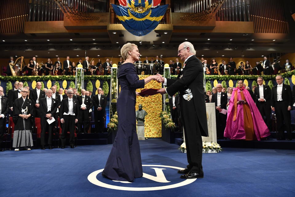 FILE - In this Dec. 10, 2018, file photo, Chemistry laureate Frances H. Arnold, left, receives the prize from King Carl Gustaf of Sweden, during the Nobel Prize award ceremony, at the Stockholm Concert Hall, in Stockholm. The Nobels, with new winners announced starting Monday, Oct. 5, 2020, often concentrate on unheralded, methodical, basic science. “Without basic science, you won’t have cutting-edge applied science,” said Frances Arnold, a Caltech chemical engineer who won the 2018 Nobel in chemistry. (Pontus Lundahl/Pool Photo via AP, File)