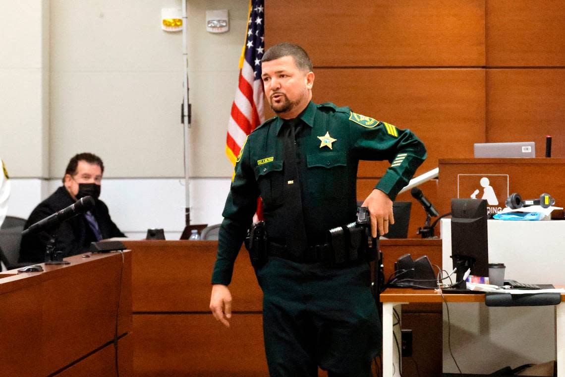 Broward Sherif’s Office Sgt. Raymond Beltran shows the jury how his Taser is deployed while testifying about a jailhouse fight he had with Nikolas Cruz in 2018. Cruz is in the penalty phase of his trial at the Broward County Courthouse in Fort Lauderdale on Wednesday, July 27, 2022. Cruz previously pleaded guilty to 17 counts of premeditated murder and 17 counts of attempted murder in the 2018 shootings.