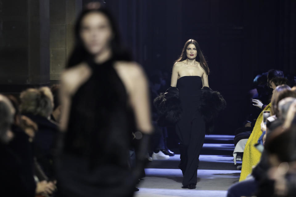 French actress Laetitia Casta wears a creation by Alexandre Mattiussi for the Ami fall-winter 22/23 men's collection, in Paris, Wednesday, Jan. 19, 2022. (AP Photo/Lewis Joly)