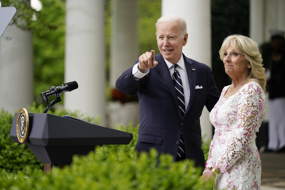 President Joe Biden points to Mexico's first lady Beatriz Gutierrez Muller as he speaks during a Cinco de Mayo event in the Rose Garden of the White House, Thursday, May 5, 2022, in Washington. First lady Jill Biden stands at right. (AP Photo/Evan Vucci)
