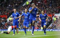 Britain Football Soccer - Manchester United v Leicester City - Barclays Premier League - Old Trafford - 1/5/16 Leicester City's Wes Morgan celebrates scoring their first goal Reuters / Darren Staples Livepic EDITORIAL USE ONLY. No use with unauthorized audio, video, data, fixture lists, club/league logos or "live" services. Online in-match use limited to 45 images, no video emulation. No use in betting, games or single club/league/player publications. Please contact your account representative for further details.