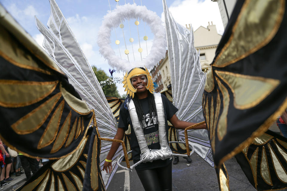 <p>Performers in costume parade on the first day of the Notting Hill Carnival in west London on August 28, 2016. (Photo: DANIEL LEAL-OLIVAS/AFP/Getty Images) </p>