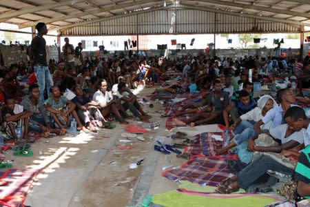 African migrants sit in a deportation center in Aden, Yemen March 17, 2018. Picture taken March 17, 2018. REUTERS/Fawaz Salman