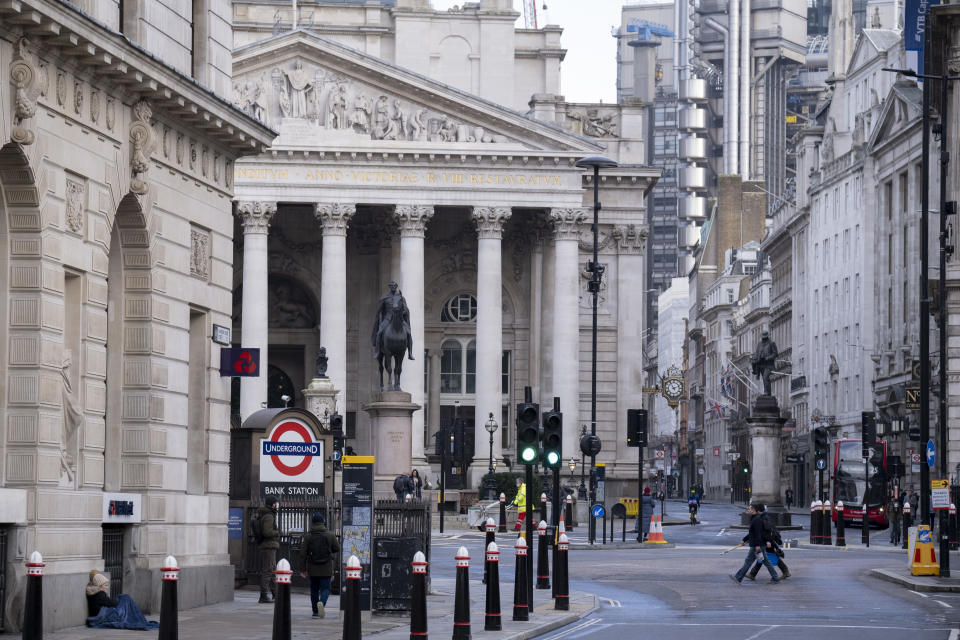 A few pedestrians and a homeless person on the junction at Bank Triangle, in front of Royal Exchange and the Bank of England, during the third lockdown of the Coronavirus pandemic, in the 'City of London', the capital's financial district, aka The Square Mile, on 2nd February 2021, in London, England. (Photo by Richard Baker / In Pictures via Getty Images)