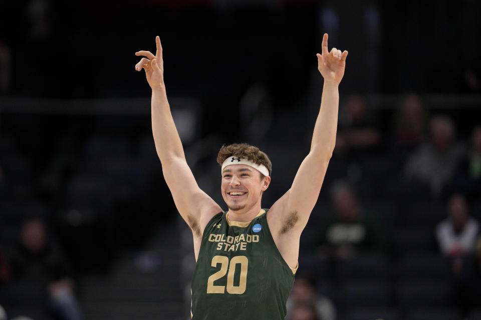 Colorado State's Joe Palmer reacts to a Jack Payne free throw during the second half of a First Four college basketball game against Virginia in the NCAA Tournament in Dayton, Ohio, Tuesday, March 19, 2024. (AP Photo/Jeff Dean)