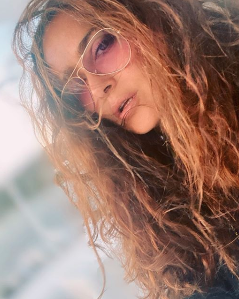 Salma Hayek sultry hair poolside photo