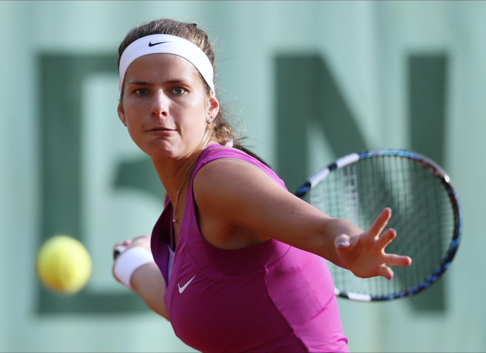 Germany's Julia Goerges hits a return to Britain's Heather Watson during their Women's Singles 2nd Round tennis match of the French Open tennis tournament at the Roland Garros stadium.      (Photo credit should read KENZO TRIBOUILLARD/AFP/GettyImages)