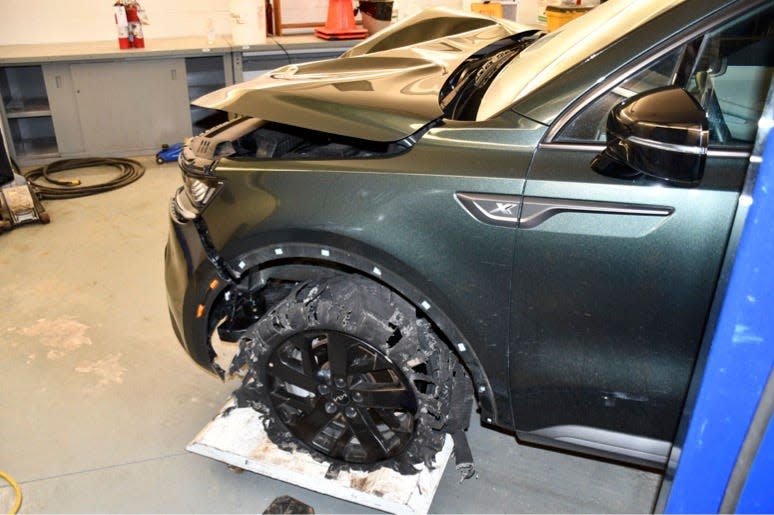 Photos from the case file show that Ortega's vehicle's front left tire was severely damaged.