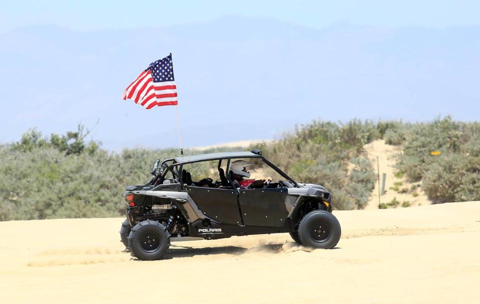 An off-roader cruises across the sand at the Oceano Dunes on Saturday, June 29, 2019.